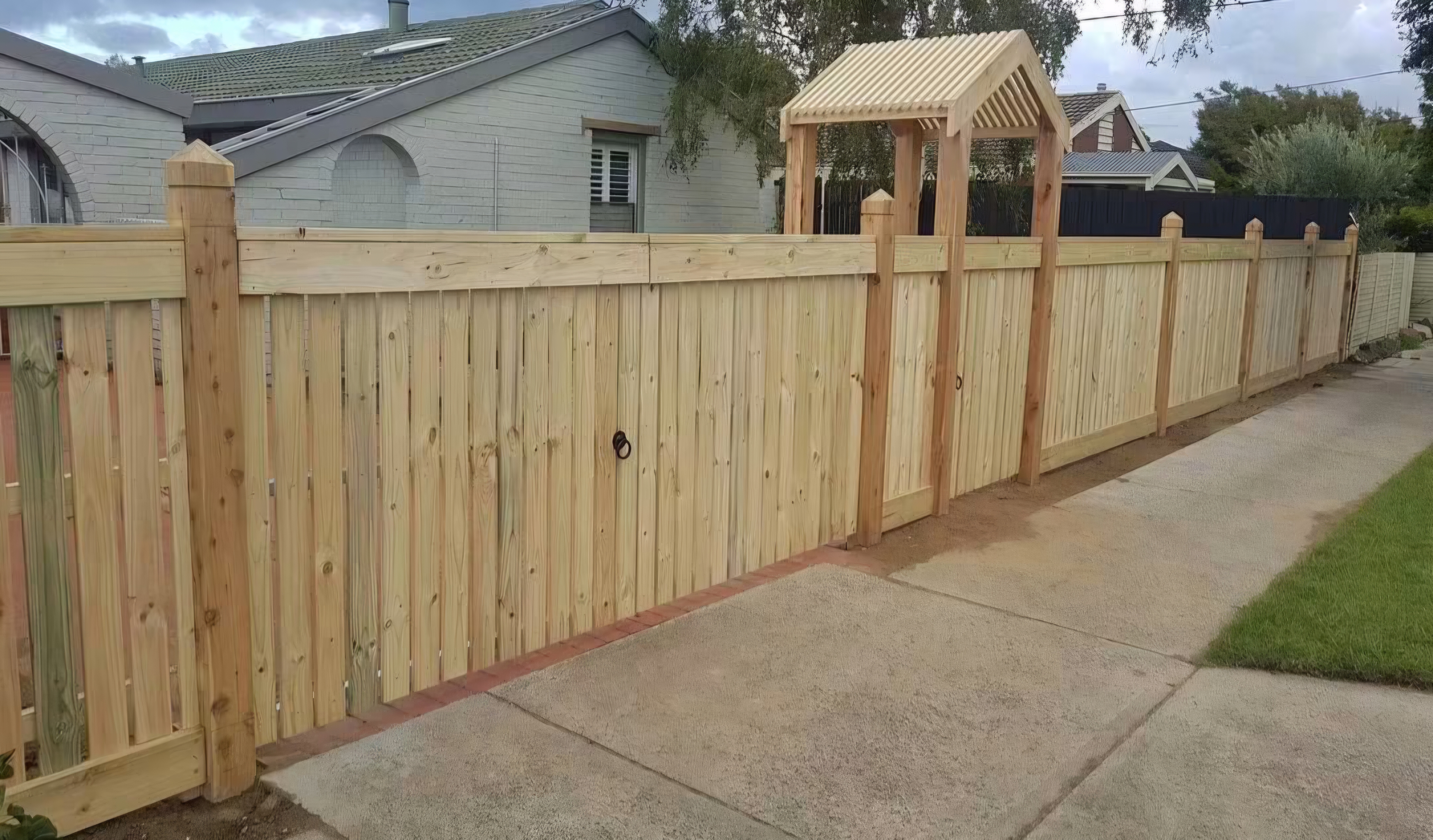 Hamptons style front fence with arbour and gate by Mordy Fencing